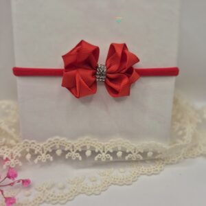 Opaska bezuciskowa z czerwoną kokardą i srebrnym środkiem